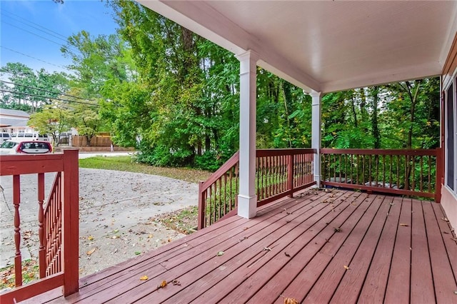 wooden terrace with a porch