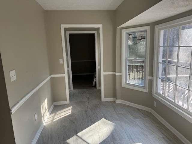 interior space featuring baseboards