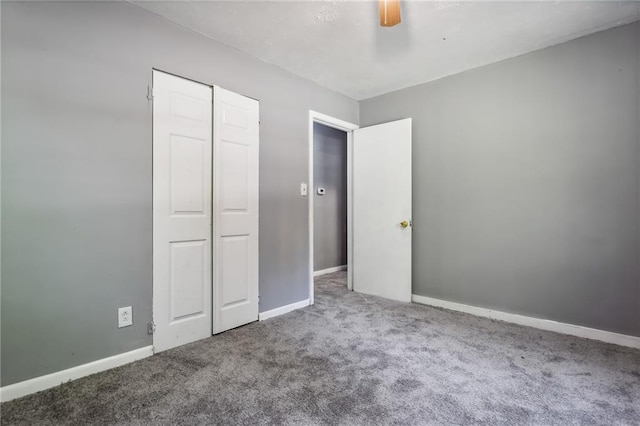 carpeted spare room with plenty of natural light and ceiling fan