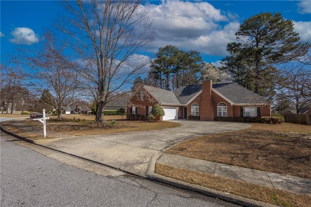 ranch-style house featuring an attached garage, brick siding, driveway, and a chimney