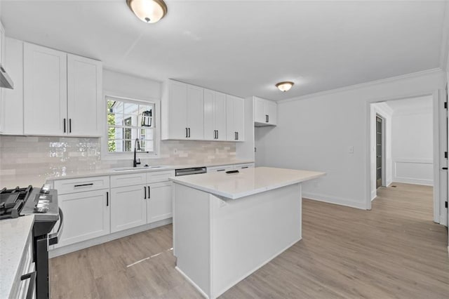 4166 Riverhill Ct NE, Roswell, GA 30075 - kitchen with a sink, stainless steel gas stove, tasteful backsplash, light countertops, and white cabinets