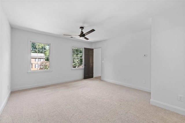 4166 Riverhill Ct NE, Roswell, GA 30075 - spare room with light carpet, ceiling fan, and baseboards
