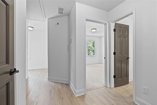4166 Riverhill Ct NE, Roswell, GA 30075 - hallway with attic access, light wood-type flooring, and baseboards