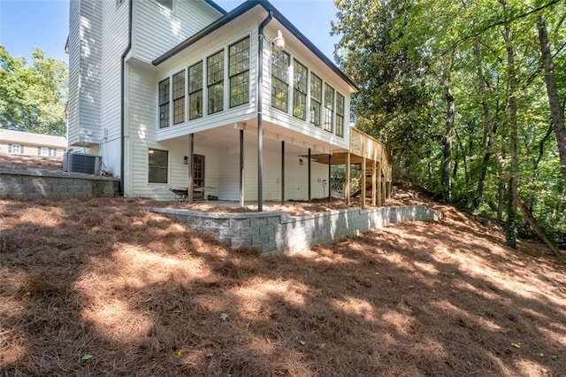 4166 Riverhill Ct NE, Roswell, GA 30075 - rear view of house with central AC and a patio