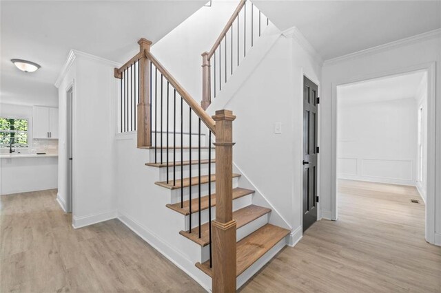 4166 Riverhill Ct NE, Roswell, GA 30075 - stairway featuring wood finished floors and ornamental molding