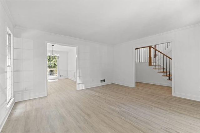 4166 Riverhill Ct NE, Roswell, GA 30075 - spare room with a chandelier, crown molding, light wood finished floors, stairs, and baseboards