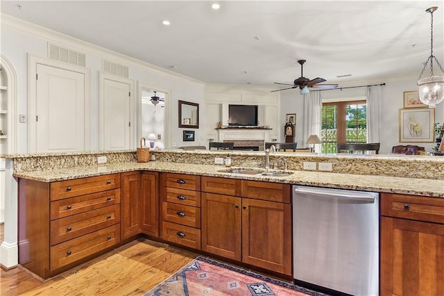 351 NE Washington Ave NE Unit 307, Marietta, GA 30060 - kitchen featuring stainless steel dishwasher, a sink, brown cabinetry, a ceiling fan, and ornamental molding