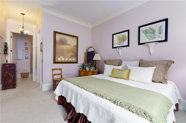 351 NE Washington Ave NE Unit 307, Marietta, GA 30060 - bedroom featuring light colored carpet, crown molding, baseboards, and a chandelier