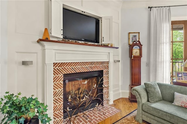 351 NE Washington Ave NE Unit 307, Marietta, GA 30060 - detailed view of wood finished floors, a tile fireplace, ornamental molding, and baseboards