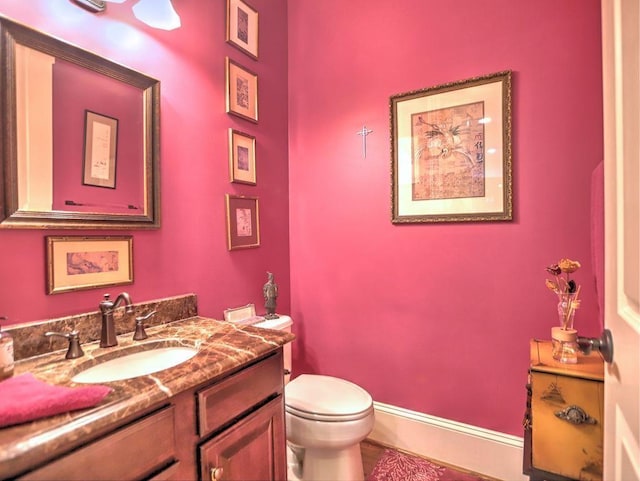 351 NE Washington Ave NE Unit 307, Marietta, GA 30060 - bathroom with toilet, vanity, and baseboards
