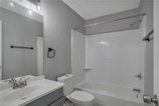 full bathroom with vanity, toilet, and tiled shower / bath combo