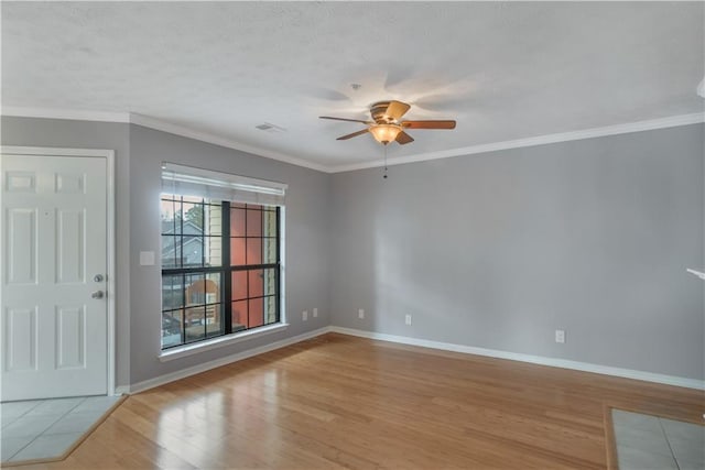 unfurnished room with crown molding, light hardwood / wood-style floors, ceiling fan, and a textured ceiling