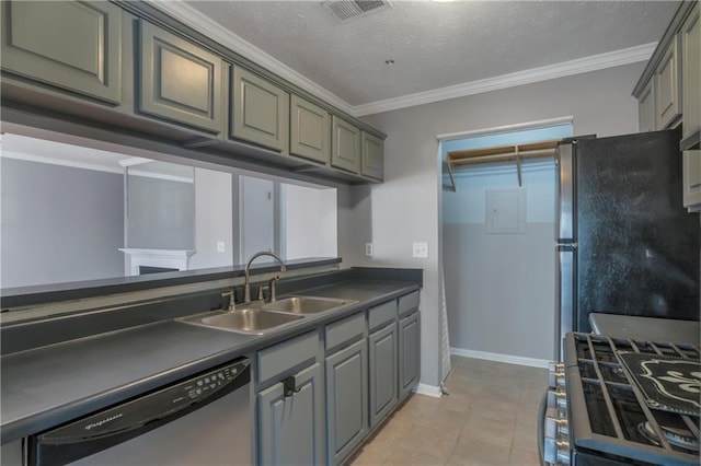 kitchen featuring appliances with stainless steel finishes, sink, and gray cabinetry