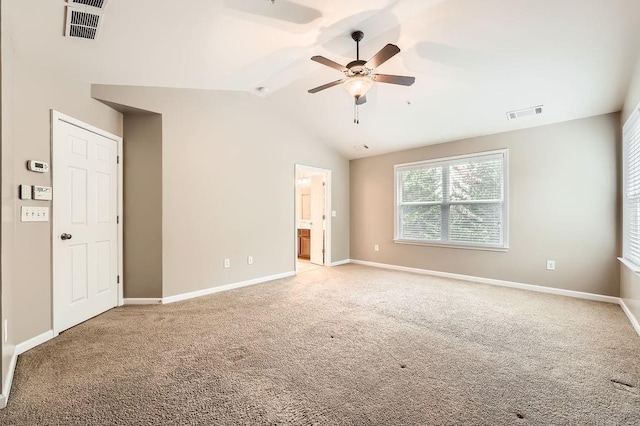 unfurnished room featuring ceiling fan, light colored carpet, and lofted ceiling