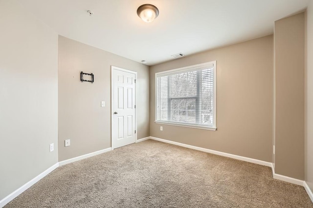 view of carpeted spare room