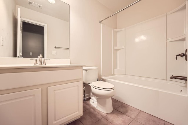 full bathroom with washtub / shower combination, vanity, tile patterned flooring, and toilet