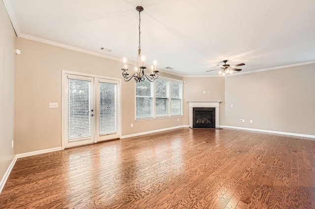 unfurnished living room with wood-type flooring, ceiling fan with notable chandelier, and ornamental molding