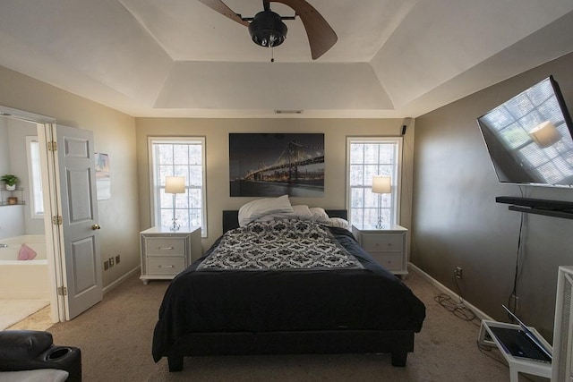 bedroom with visible vents, a raised ceiling, carpet, baseboards, and ceiling fan