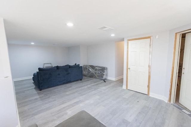 unfurnished living room featuring recessed lighting, visible vents, baseboards, and wood finished floors