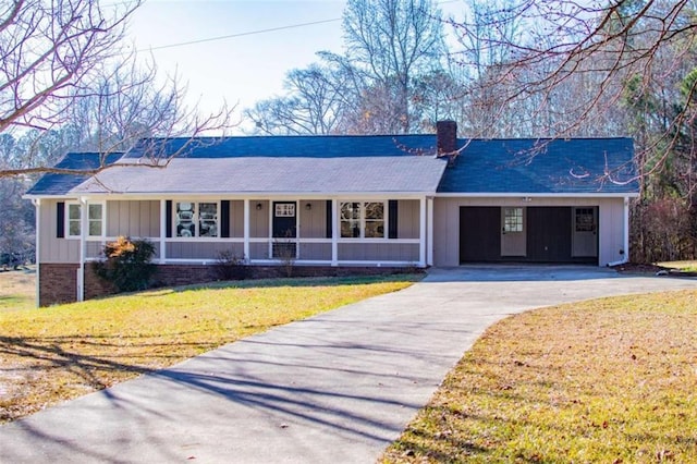 280 Hitchcock Rd, Dallas, GA 30157 - ranch-style house featuring board and batten siding, a chimney, concrete driveway, a front lawn, and a shingled roof