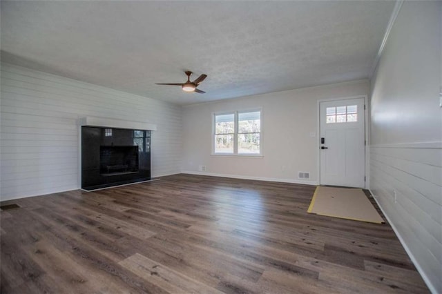 280 Hitchcock Rd, Dallas, GA 30157 - unfurnished living room featuring crown molding, ceiling fan, wood finished floors, a fireplace, and a textured ceiling