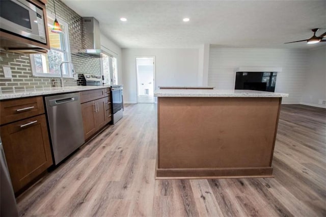 280 Hitchcock Rd, Dallas, GA 30157 - kitchen with stainless steel appliances, light wood-style floors, light stone counters, open floor plan, and recessed lighting