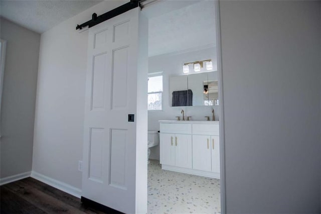 280 Hitchcock Rd, Dallas, GA 30157 - full bathroom with toilet, double vanity, baseboards, and wood finished floors