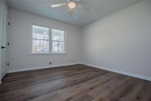 280 Hitchcock Rd, Dallas, GA 30157 - spare room featuring dark wood finished floors, baseboards, and ceiling fan