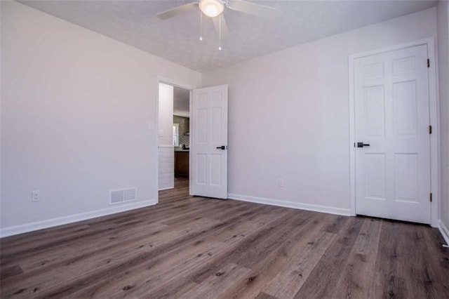 280 Hitchcock Rd, Dallas, GA 30157 - unfurnished bedroom featuring wood finished floors, baseboards, and ceiling fan