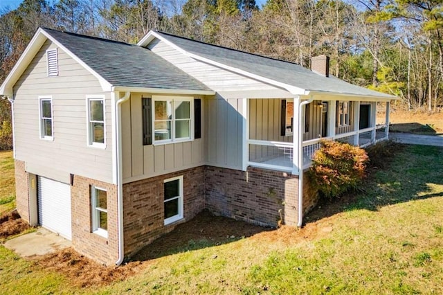 280 Hitchcock Rd, Dallas, GA 30157 - view of side of property featuring a chimney, a lawn, board and batten siding, brick siding, and roof with shingles