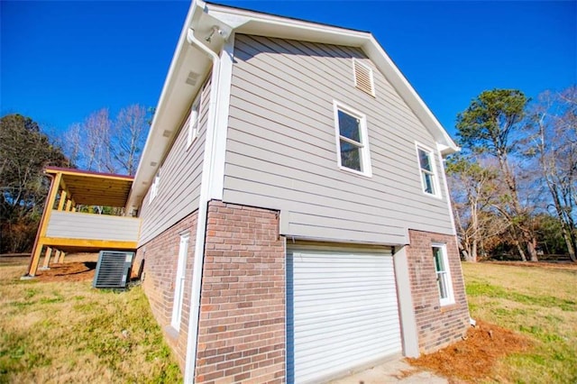 280 Hitchcock Rd, Dallas, GA 30157 - view of side of home featuring brick siding, cooling unit, a garage, and a lawn