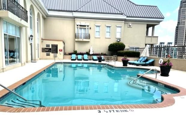 view of pool featuring a patio area