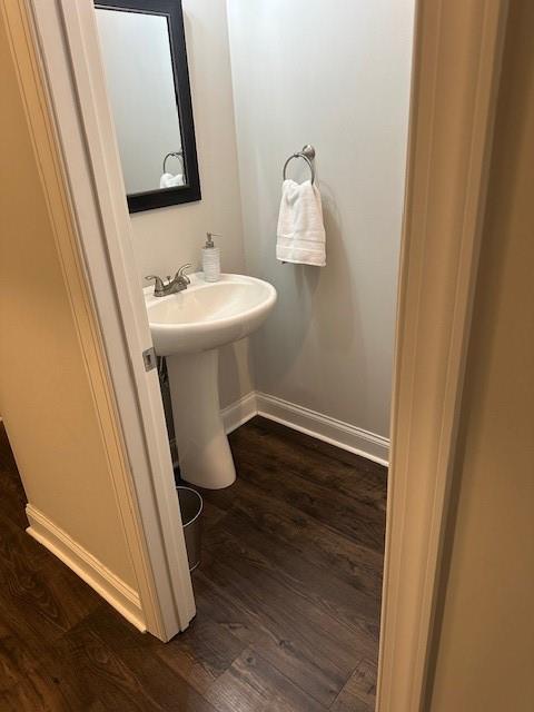 2159 Holland Creek Ln, Buford, GA 30519 - bathroom with wood finished floors and baseboards
