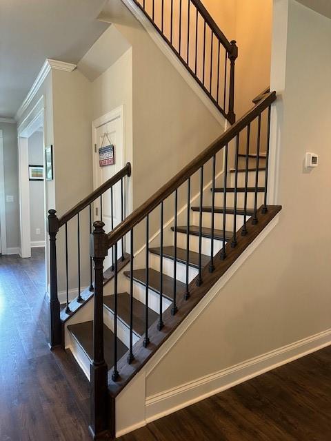 2159 Holland Creek Ln, Buford, GA 30519 - stairs featuring ornamental molding, wood finished floors, and baseboards