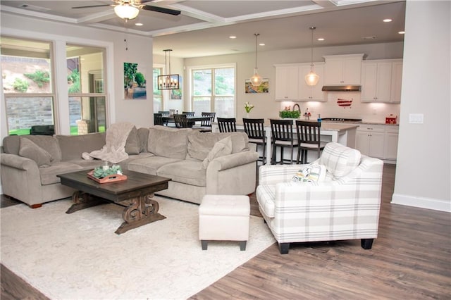2159 Holland Creek Ln, Buford, GA 30519 - living room featuring dark wood-style floors, ceiling fan, recessed lighting, a chandelier, and coffered ceiling