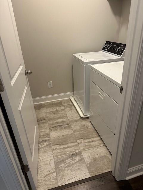 2159 Holland Creek Ln, Buford, GA 30519 - laundry room with independent washer and dryer and baseboards