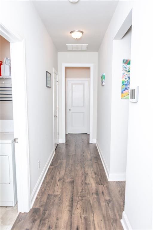 2159 Holland Creek Ln, Buford, GA 30519 - hallway with wood finished floors and washer / clothes dryer