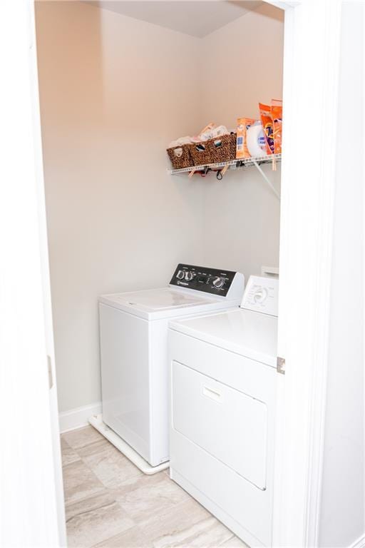 2159 Holland Creek Ln, Buford, GA 30519 - washroom featuring washer and clothes dryer and baseboards