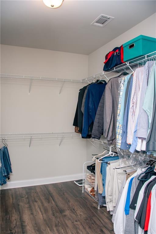 2159 Holland Creek Ln, Buford, GA 30519 - walk in closet with wood finished floors