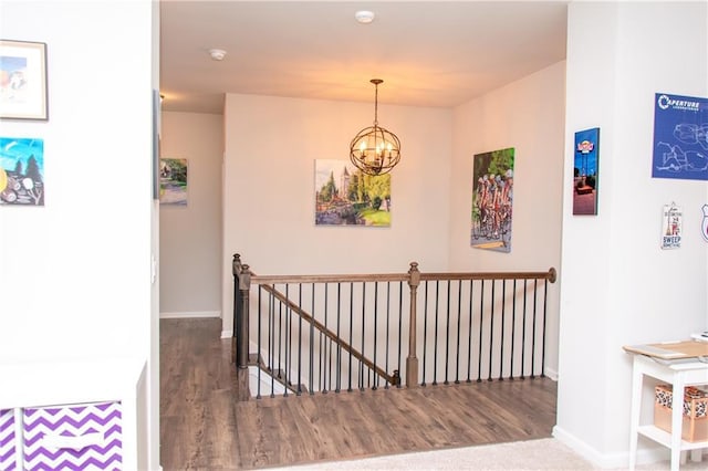 2159 Holland Creek Ln, Buford, GA 30519 - hallway with an upstairs landing, wood finished floors, and a chandelier