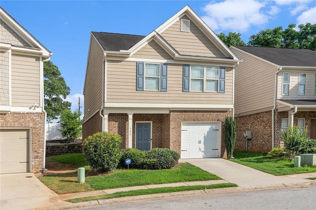 368 Rankin Cir, Mcdonough, GA 30253 - view of front facade with driveway, brick siding, and an attached garage