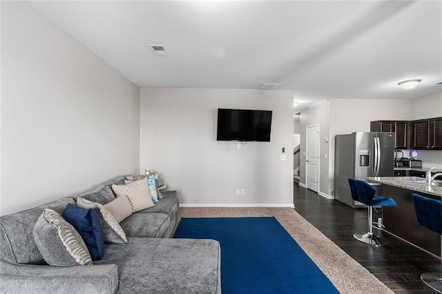 368 Rankin Cir, Mcdonough, GA 30253 - living area featuring dark wood-type flooring and baseboards