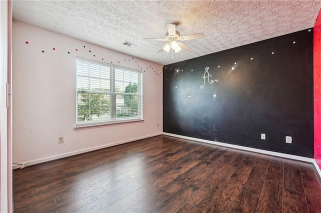 unfurnished room featuring ceiling fan, a textured ceiling, and dark hardwood / wood-style flooring