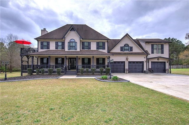 view of front of house featuring a garage, covered porch, and a front yard