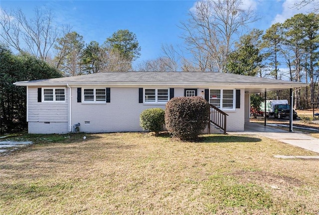 ranch-style house featuring a carport and a front yard