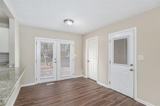 interior space with french doors and dark wood-type flooring