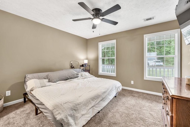 724 Westbury Dr, Bethlehem, GA 30620 - bedroom with light carpet, a ceiling fan, and a textured ceiling