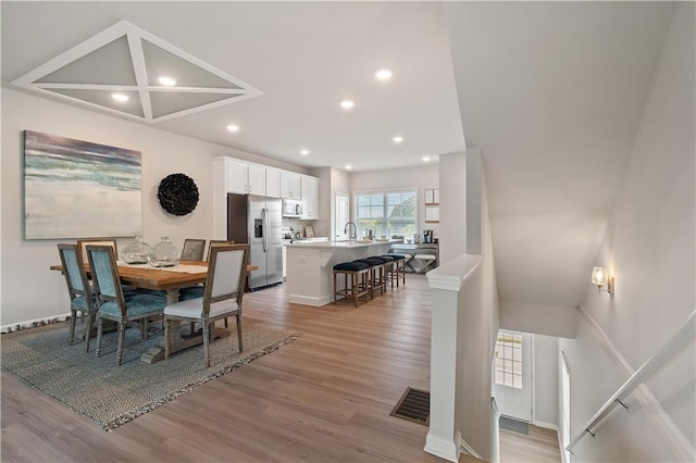 27 Cobalt Ln Unit 77, Newnan, GA 30265 - dining space with light wood finished floors, recessed lighting, and baseboards