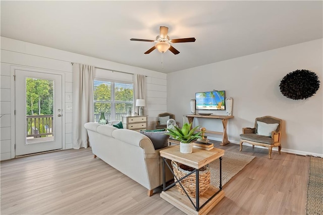 27 Cobalt Ln Unit 77, Newnan, GA 30265 - living area featuring light wood-style floors, ceiling fan, and baseboards