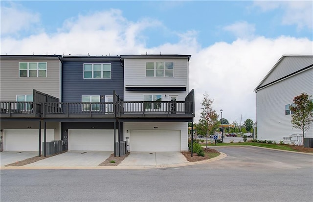 27 Cobalt Ln Unit 77, Newnan, GA 30265 - view of front facade featuring an attached garage, driveway, and central AC